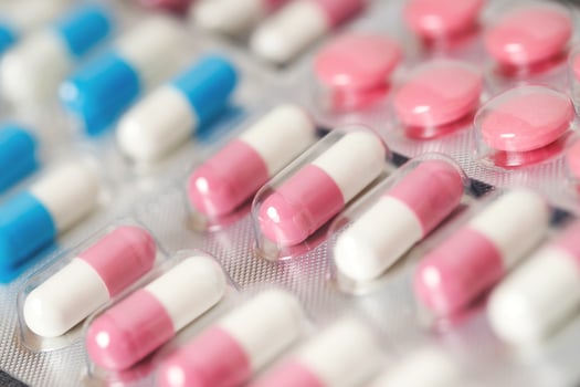 close up pharmaceuticals antibiotics pills medicine in blister packs. colorful antibacterials pills Pharmacy background. capsule pill medicine Antimicrobial drug resistance. Pharmaceutical industry photo