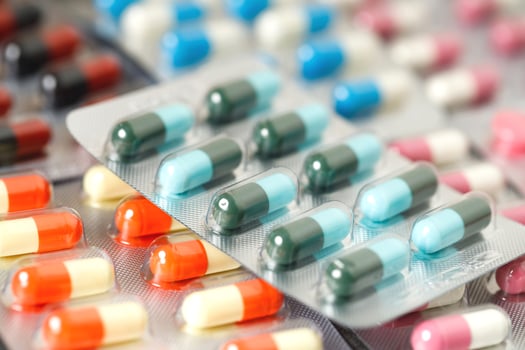 close up pharmaceuticals antibiotics pills medicine in blister packs. colorful antibacterials pills Pharmacy background. capsule pill medicine Antimicrobial drug resistance. Pharmaceutical industry photo