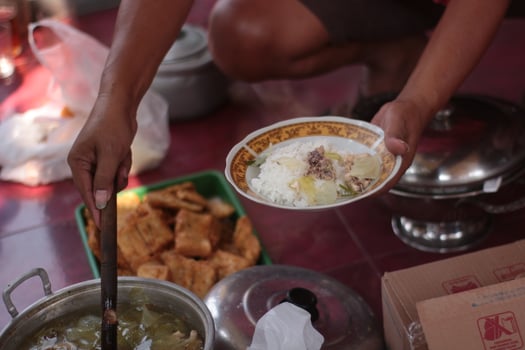 Someone is taking food after community service activities. photo
