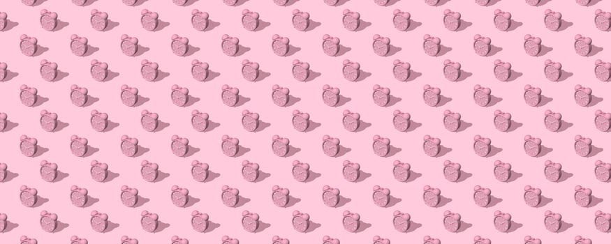 Banner of pink alarm clocks with shadow on pink background. Set. Seamless texture pattern. 3D illustration. Long shadow from the summer sunshine. photo