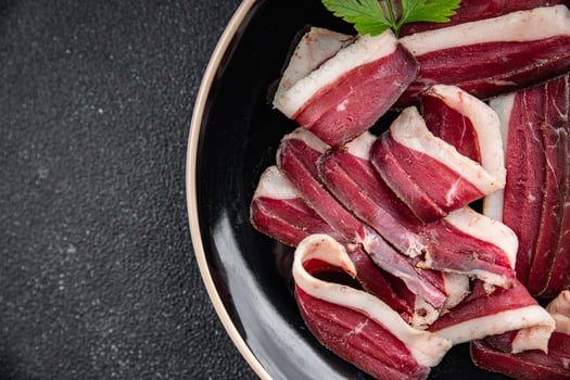 dried duck breast magret smoked jerky cured dried meat fresh delicious eating cooking appetizer meal food snack on the table copy space photo