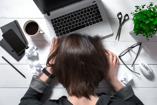 Overhead view of businesswoman working at computer in office photo