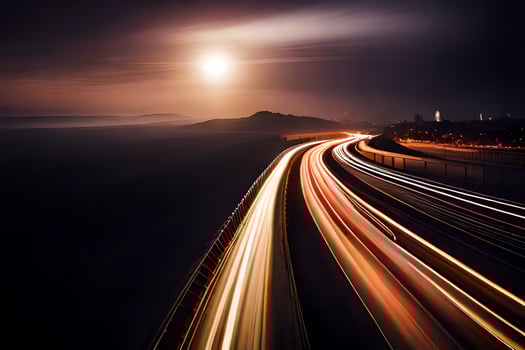 a long exposure photo of a highway at night. AI-Generated