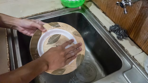 the activity of someone washing dishes photo
