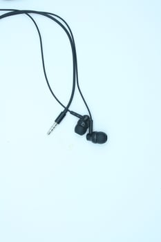 black earphones isolated on white background. close up of earphones photo