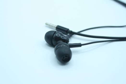 black earphones isolated on white background. close up of earphones photo