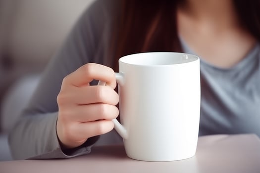 Woman Holding Blank White Mug - Coffee Cup Mockup.Created with Generative AI technology. photo