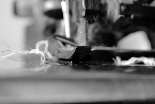 Vintage Black and White Close up Serger or Overlock Machine with threads, vintage black and white concept photo