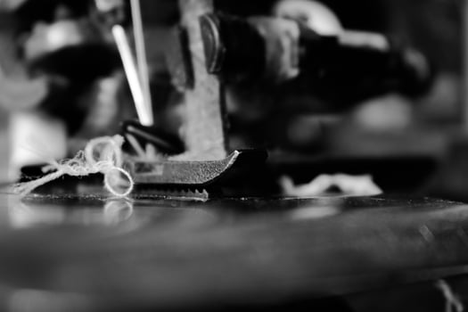 Vintage Black and White Close up Serger or Overlock Machine with threads, vintage black and white concept photo