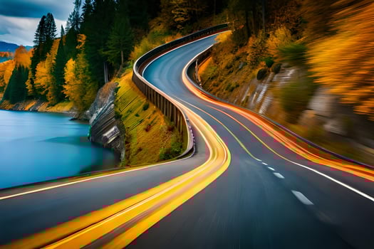 a car driving on a winding road with a lake in the background. AI-Generated photo