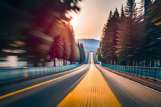 a blurry image of a road with trees and a yellow line. AI-Generated photo