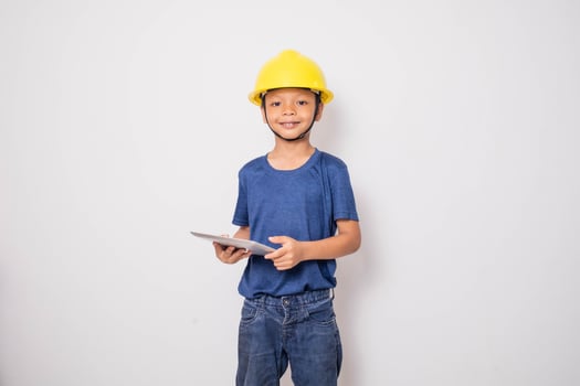 Boy wearing yellow hat  engineer idea photo