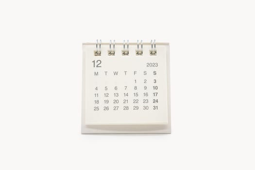 Simple desk calendar for December 2023 isolated on white background. Calendar concept with copy space. photo