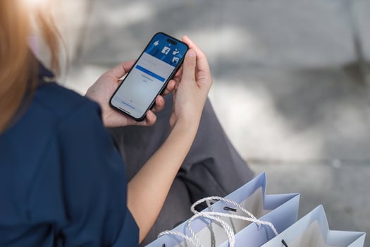 Facebook social media app logo on log-in, sign-up registration page on mobile app screen on iPhone 14 in person's hand working on e-commerce shopping online photo