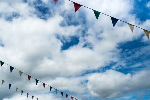 Triangle flag hanging on the rope and blue sky photo