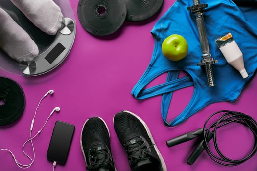 Fitness female outfit background top view. Set of sport clothing and equipment for women, active lifestyle photo