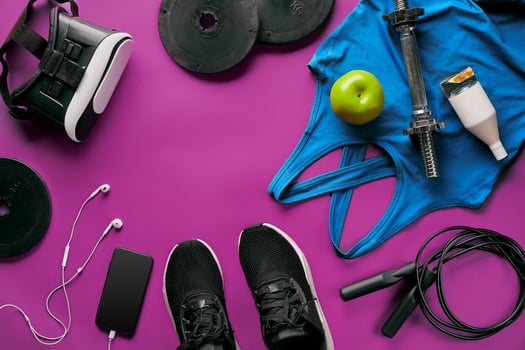 Fitness female outfit background top view. Set of sport clothing and equipment for women, active lifestyle photo