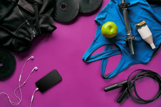 Fitness female outfit background top view. Set of sport clothing and equipment for women, active lifestyle photo