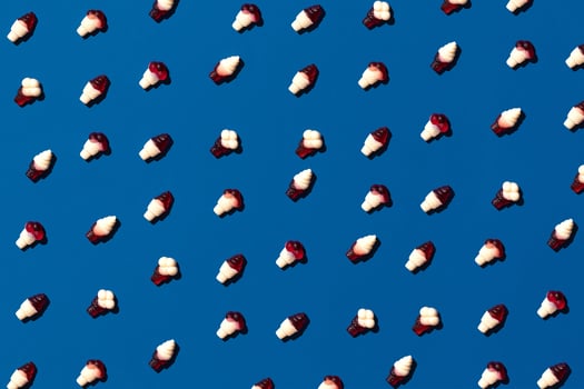 Top view image tasty concept, minimal Sweet Candy jelly bean Colorful pattern on blue pastel. photo