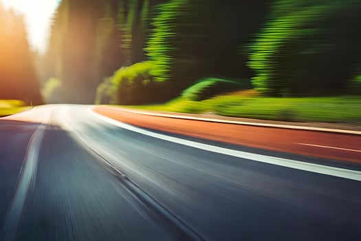 a blurry image of a road with trees in the background. AI-Generated photo