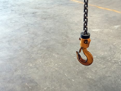 Yellow Steel chain hooks for hang heavy material in factory photo