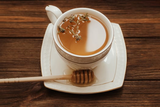 Herbal green tea in a white cup on the table. photo