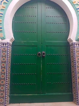 Green wooden door in the old city of Tetouan, Morocco photo