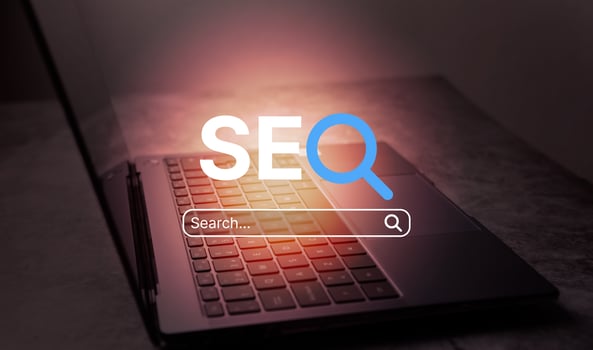 Desk photo with open laptop and VR SEO text interface. SEO Search Engine Optimization concept. Ranking traffic on website. Digital marketing business technology.