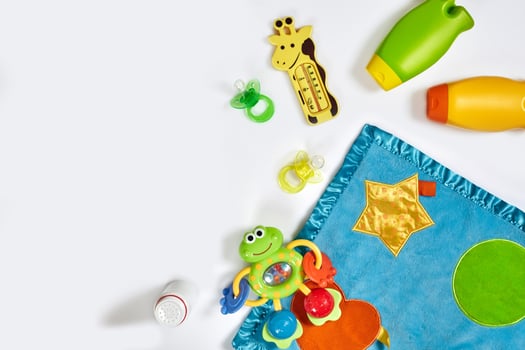 Set of accessories for baby. Pacifier, bottle, diaper, cream on white background. photo