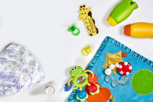 Set of accessories for baby. Pacifier, bottle, diaper, cream on white background. photo