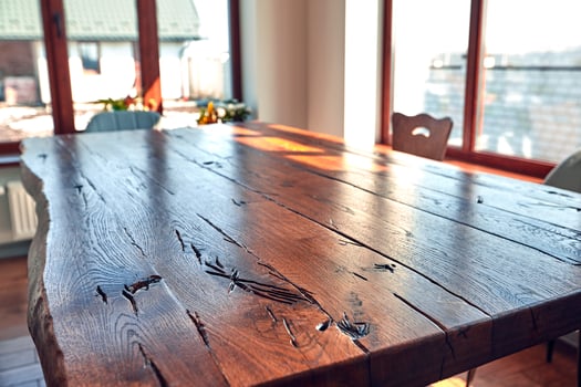 Interior of modern house, dining room with wooden table photo