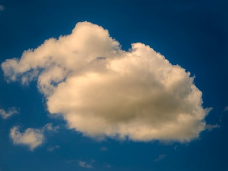 White fluffy cloud over blue summer sky background photo