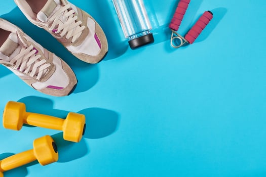 Female sport shoes and equipment top view, copy space. Active lifestyle, body care concept. photo