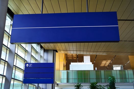 Empty information board sign at airport or train station photo
