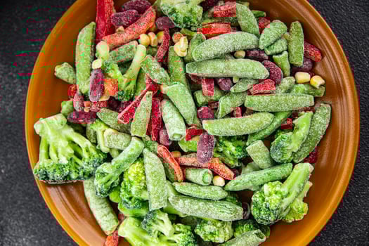 frozen vegetables mix broccoli, corn, carrots, green peas, green beans, bell peppers, beans fresh delicious healthy eating cooking appetizer meal food snack on the table photo