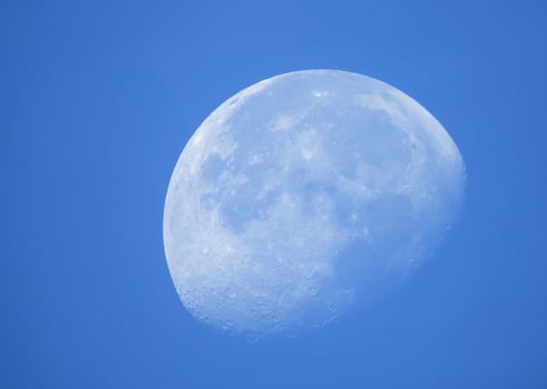 Phase of the moon in daytime. photo