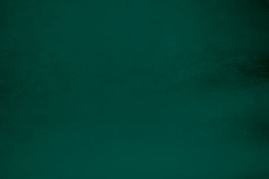 Green velvet fabric texture used as background. Emerald color panne fabric background of soft and smooth textile material. crushed velvet .luxury emerald tone for silk.. photo