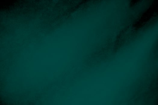 Dark green velvet fabric texture gradient used as background. Emerald color panne fabric background of soft and smooth textile material. crushed velvet .luxury emerald tone for silk. photo