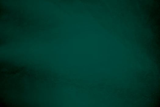 Green velvet fabric texture used as background. Emerald color panne fabric background of soft and smooth textile material. crushed velvet .luxury emerald tone for silk.. photo
