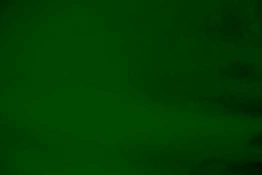 Light green velvet fabric texture gradient used as background. Emerald color panne fabric background of soft and smooth textile material. crushed velvet .luxury emerald tone for silk. photo