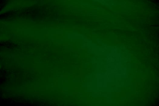 Light green velvet fabric texture gradient used as background. Emerald color panne fabric background of soft and smooth textile material. crushed velvet .luxury emerald tone for silk. photo