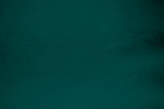 Dark green velvet fabric texture gradient used as background. Emerald color panne fabric background of soft and smooth textile material. crushed velvet .luxury emerald tone for silk. photo