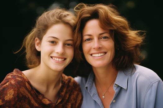 Portrait of Happy Mother and Daughter Looking at Camera Outdoors photo