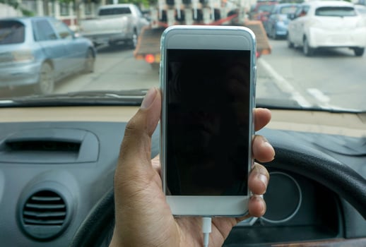 using a smartphone while driving a car photo