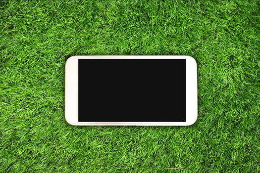 smartphone on grass photo