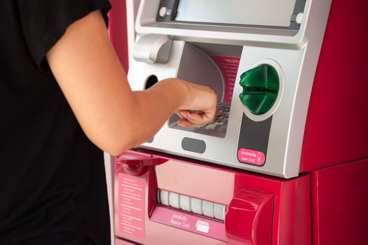 pressing ATM machine photo