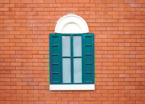 Green shuttered window set in a warm red brick wall, rustic European character with vintage texture and timeless facade detail, perfect for travel, heritage, and architecture use. photo