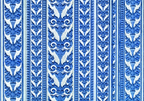 A blue and white pattern with ornate designs photo