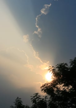Sun rays through the clouds photo