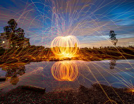 A firework is lit up by the light of the sun photo